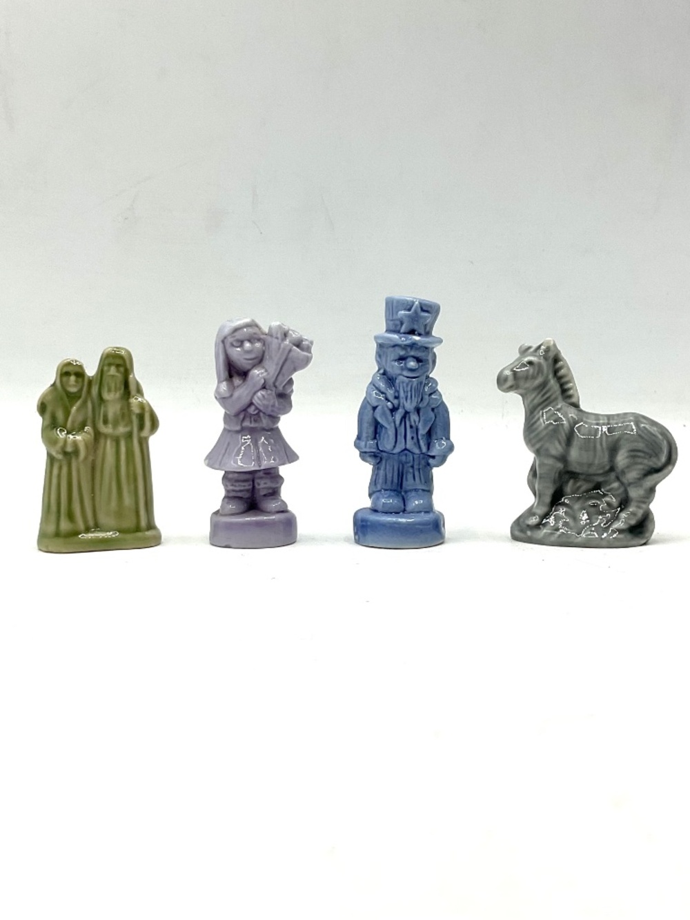 4 Wade Figurines